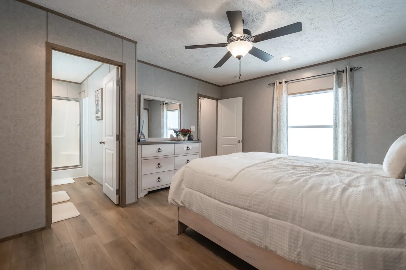 The WARRIOR II Primary Bedroom. This Manufactured Mobile Home features 2 bedrooms and 2 baths.