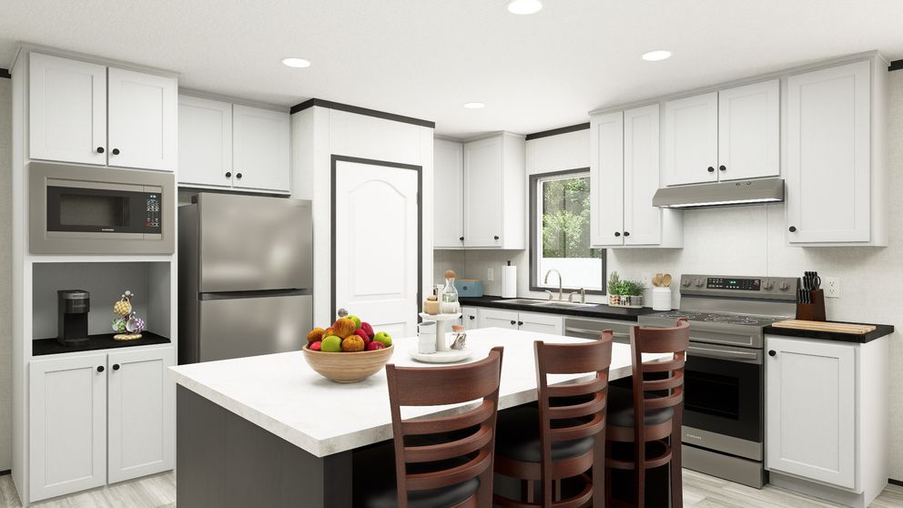 The THE MOUNTAINEER 56 Kitchen. This Manufactured Mobile Home features 3 bedrooms and 2 baths.