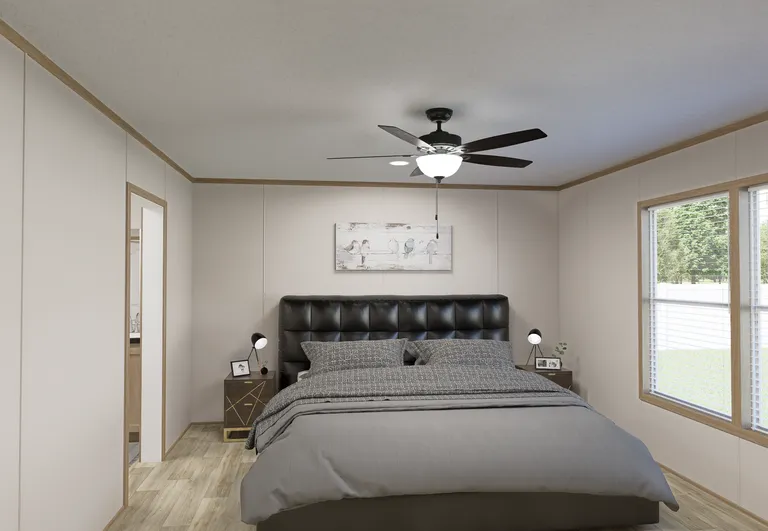 The THE MOUNTAINEER 72 Primary Bedroom. This Manufactured Mobile Home features 3 bedrooms and 2 baths.