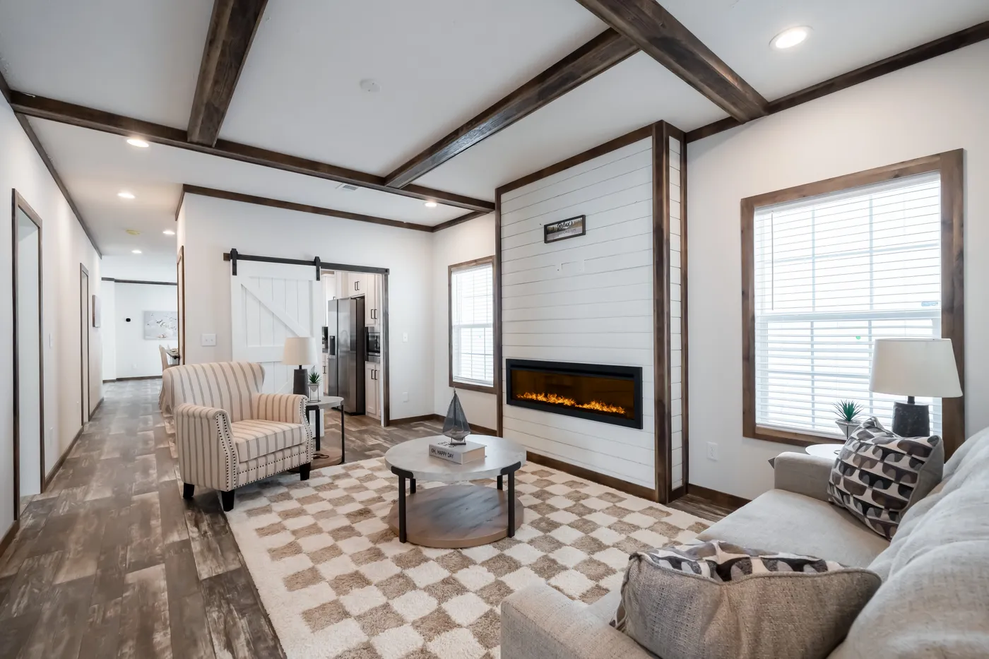 The 3237 THE TYBEE HUD Living Room. This Manufactured Mobile Home features 4 bedrooms and 3 baths.