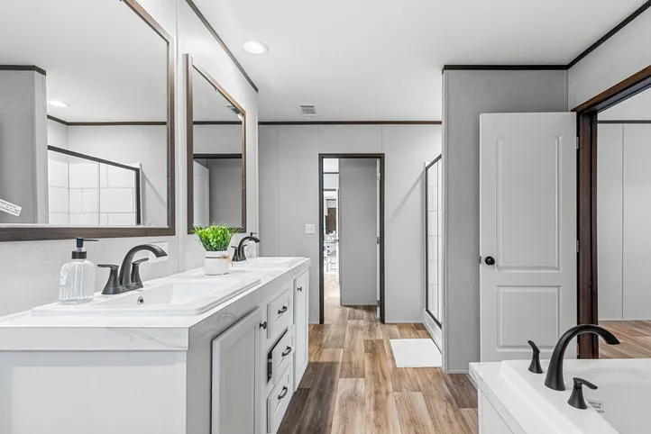 The THE ANNIVERSARY 2.1 Primary Bathroom. This Manufactured Mobile Home features 3 bedrooms and 2 baths.