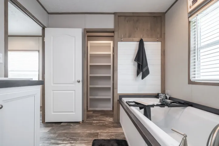 The RIVERHAVEN Primary Bathroom. This Manufactured Mobile Home features 3 bedrooms and 2 baths.