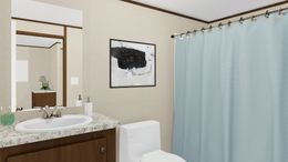 The SPECTACULAR Primary Bathroom. This Manufactured Mobile Home features 3 bedrooms and 2 baths.