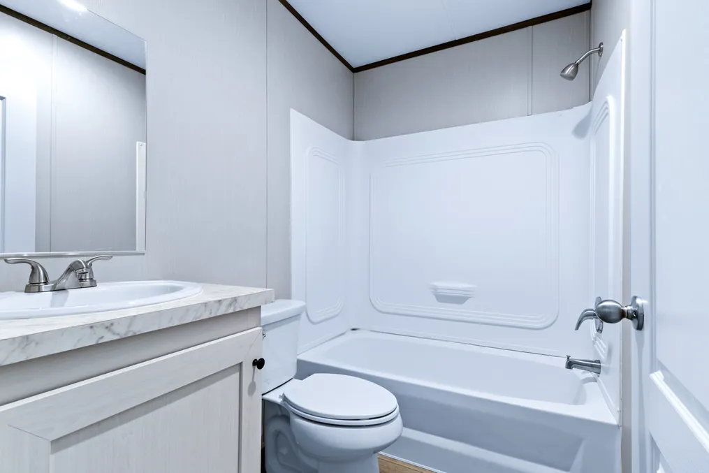 The ANNIVERSARY 16763S Guest Bathroom. This Manufactured Mobile Home features 3 bedrooms and 2 baths.