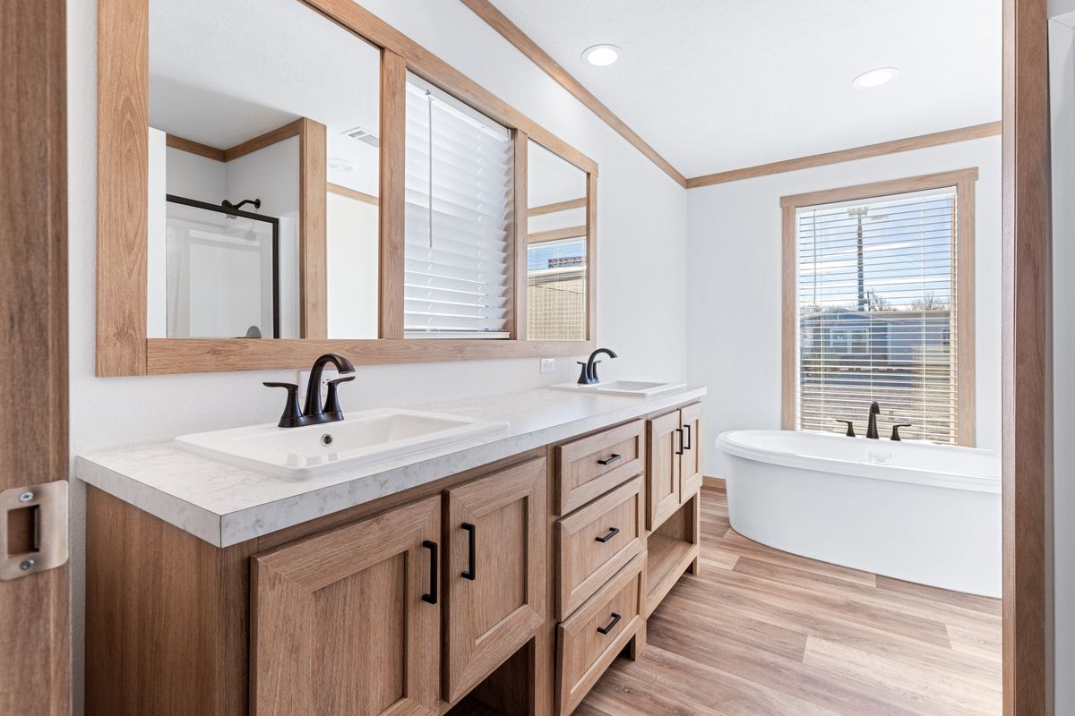 The TINSLEY Primary Bathroom. This Manufactured Mobile Home features 4 bedrooms and 2 baths.