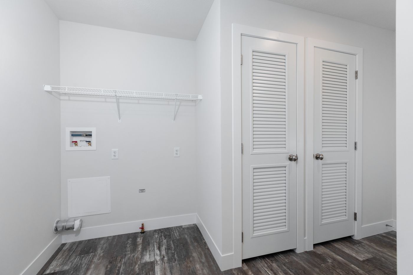 The ECLIPSE/6028-MS063 Utility Room. This Manufactured Mobile Home features 3 bedrooms and 2 baths.