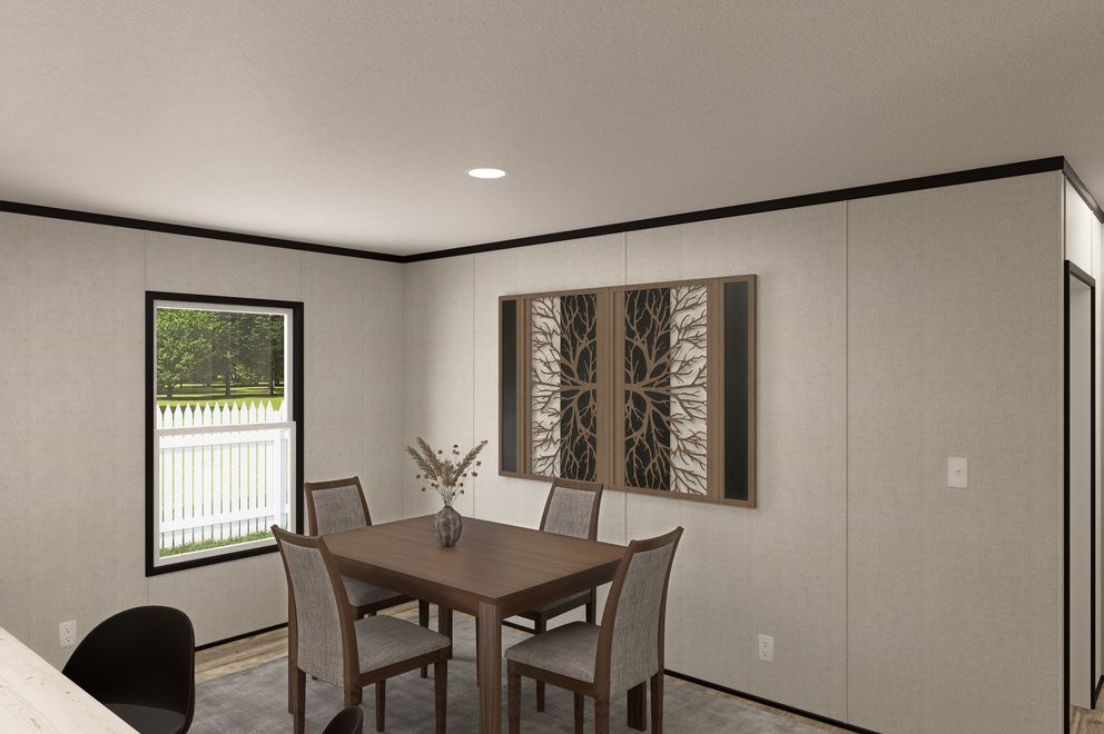 The THE MOUNTAINEER 48 Dining Area. This Manufactured Mobile Home features 3 bedrooms and 2 baths.