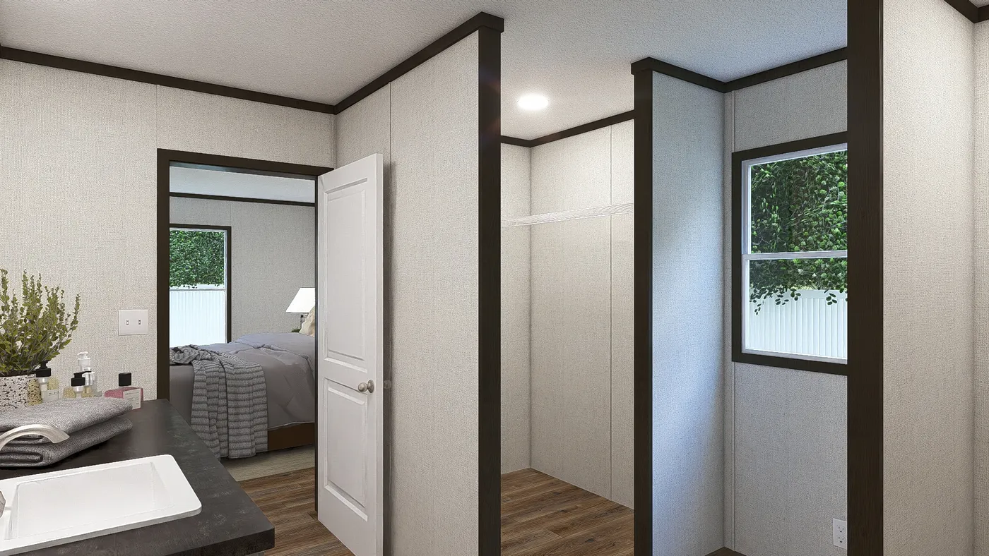 The EMPOWER Primary Bathroom. This Manufactured Mobile Home features 4 bedrooms and 2 baths.