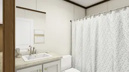 The DESIRE Guest Bathroom. This Manufactured Mobile Home features 3 bedrooms and 2 baths.