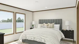 The GLIMPSE Primary Bedroom. This Manufactured Mobile Home features 3 bedrooms and 2 baths.