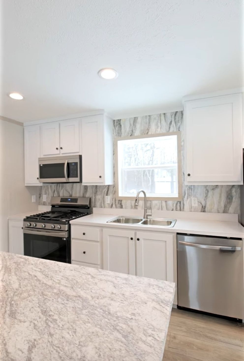 The TURQUOISE Kitchen. This Manufactured Mobile Home features 2 bedrooms and 2 baths.