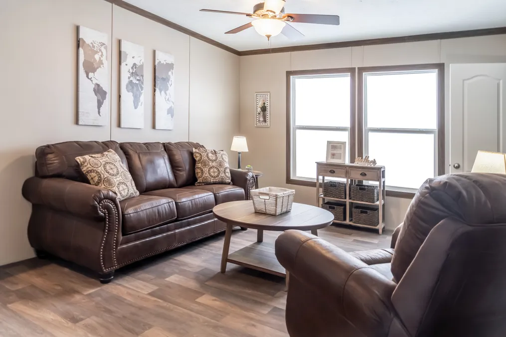 The FARMHOUSE BREEZE 72 Living Room. This Manufactured Mobile Home features 4 bedrooms and 2 baths.