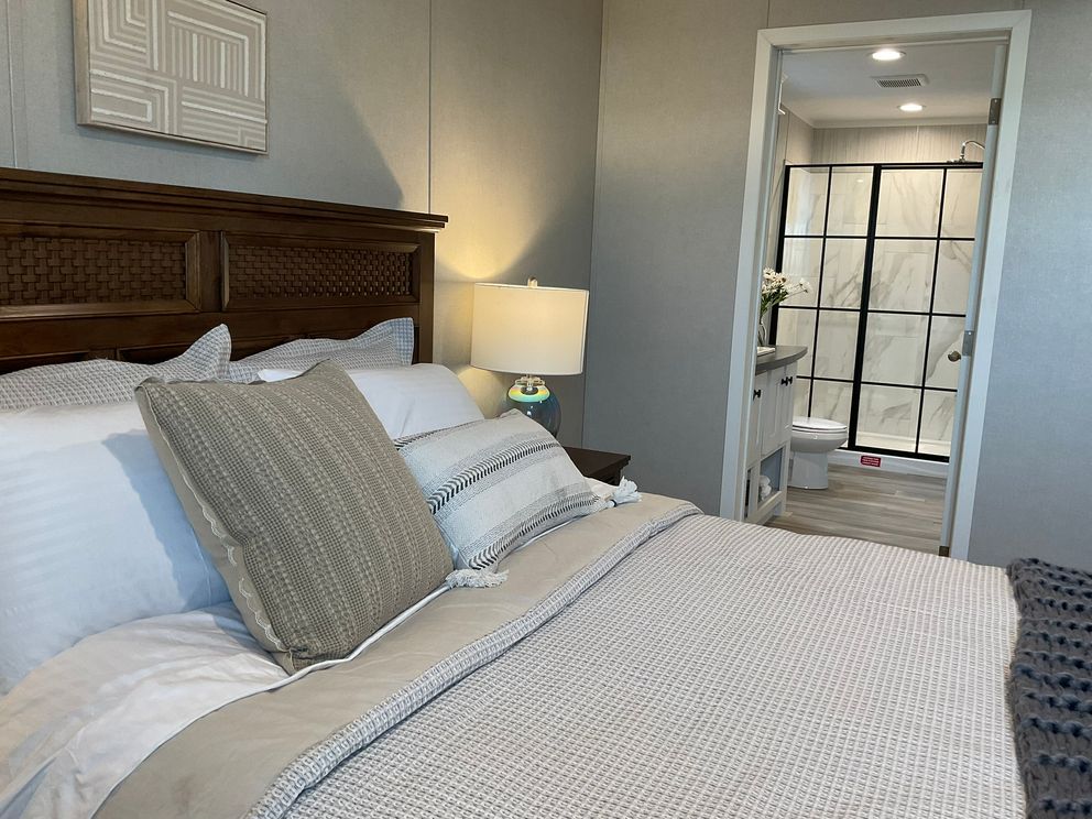 The AMETHYST Primary Bedroom. This Manufactured Mobile Home features 3 bedrooms and 2 baths.