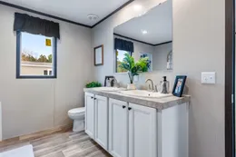 The COLOSSAL Primary Bathroom. This Manufactured Mobile Home features 3 bedrooms and 2 baths.