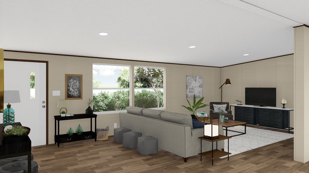 The TRIUMPH Living Room. This Manufactured Mobile Home features 5 bedrooms and 3 baths.
