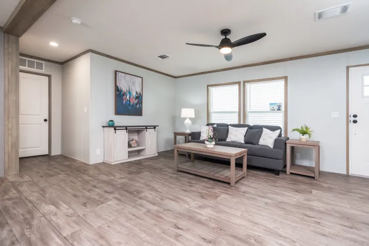 The BLUEBONNET BREEZE Living Room. This Manufactured Mobile Home features 3 bedrooms and 2 baths.