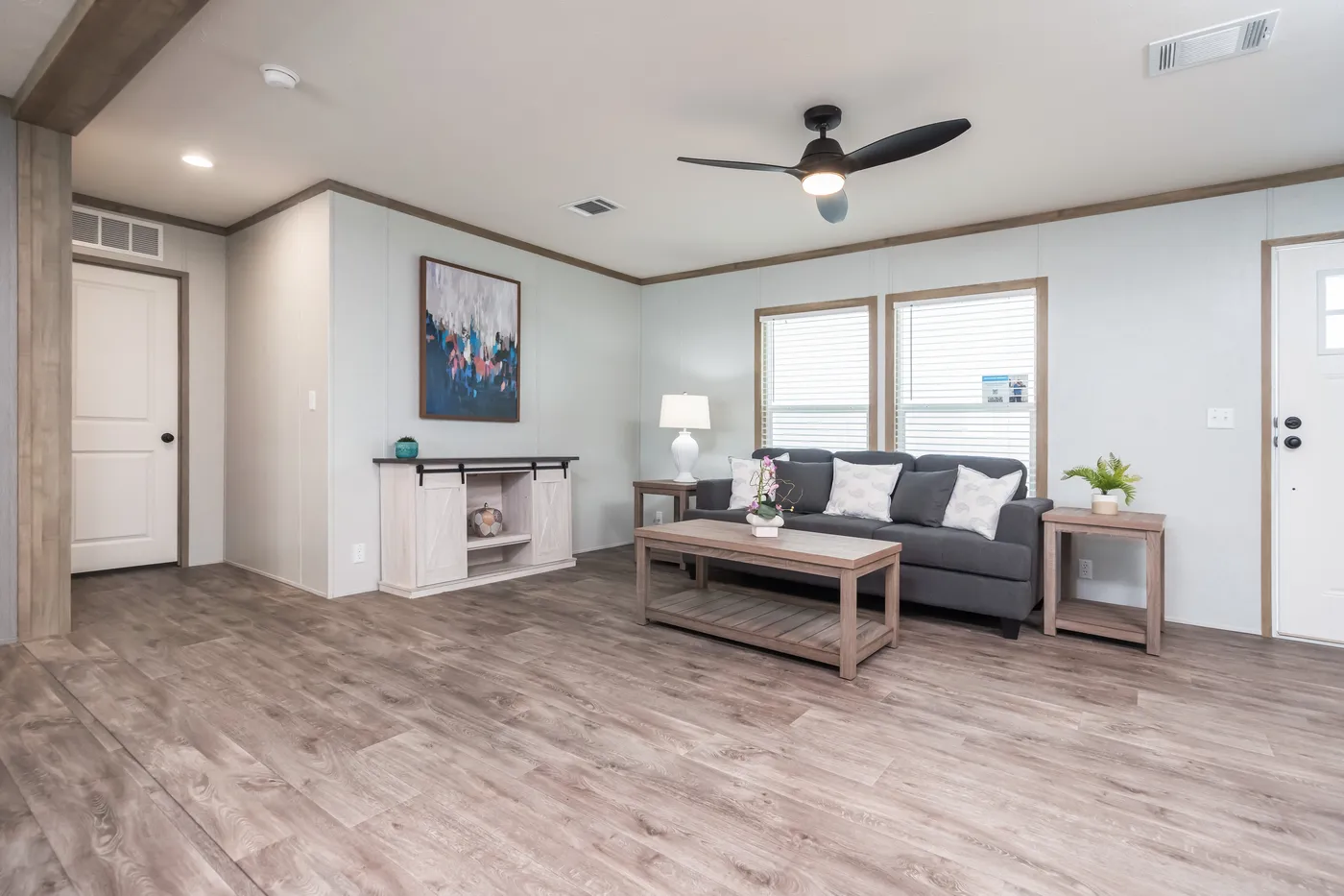 The BLUEBONNET BREEZE Living Room. This Manufactured Mobile Home features 3 bedrooms and 2 baths.
