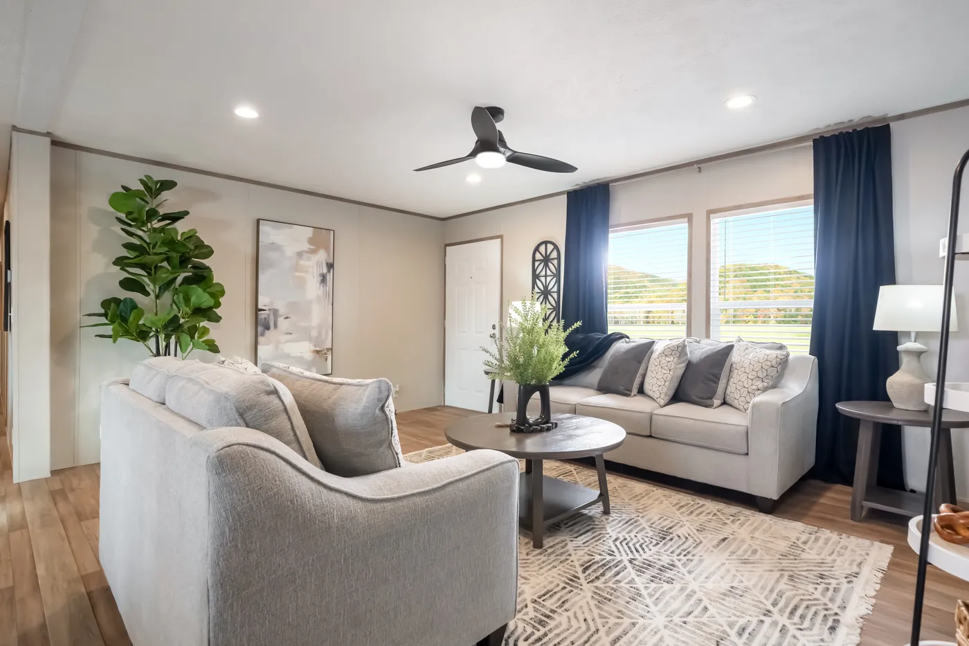 The ECLIPSE Living Room. This Manufactured Mobile Home features 4 bedrooms and 2 baths.