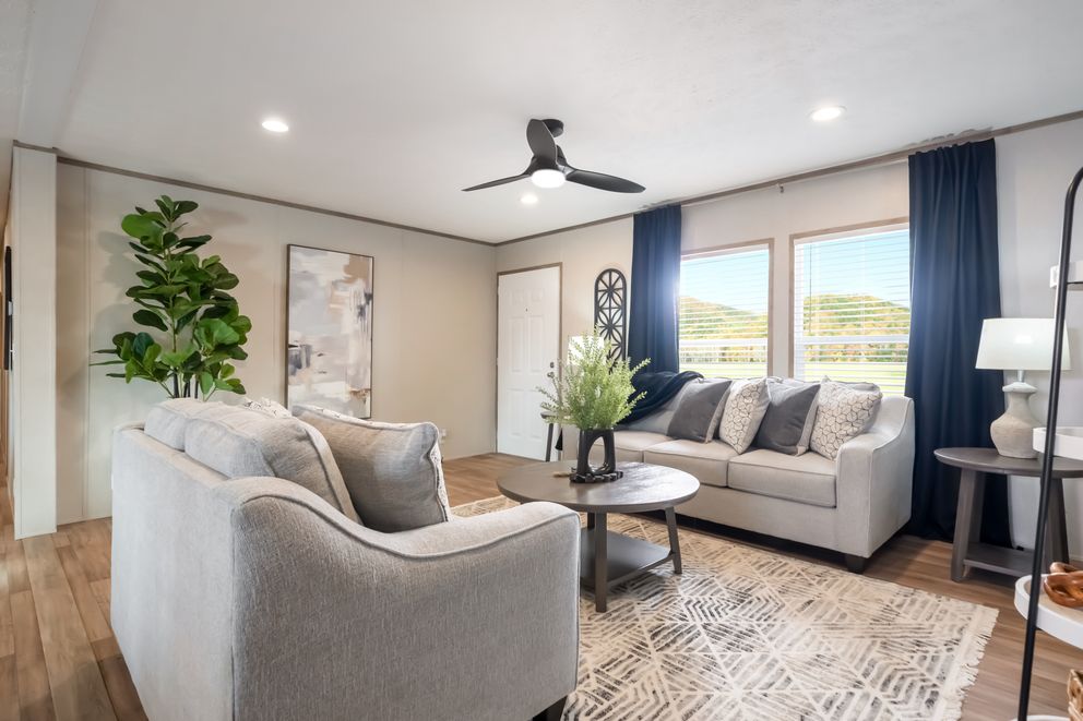 The ECLIPSE Living Room. This Manufactured Mobile Home features 4 bedrooms and 2 baths.