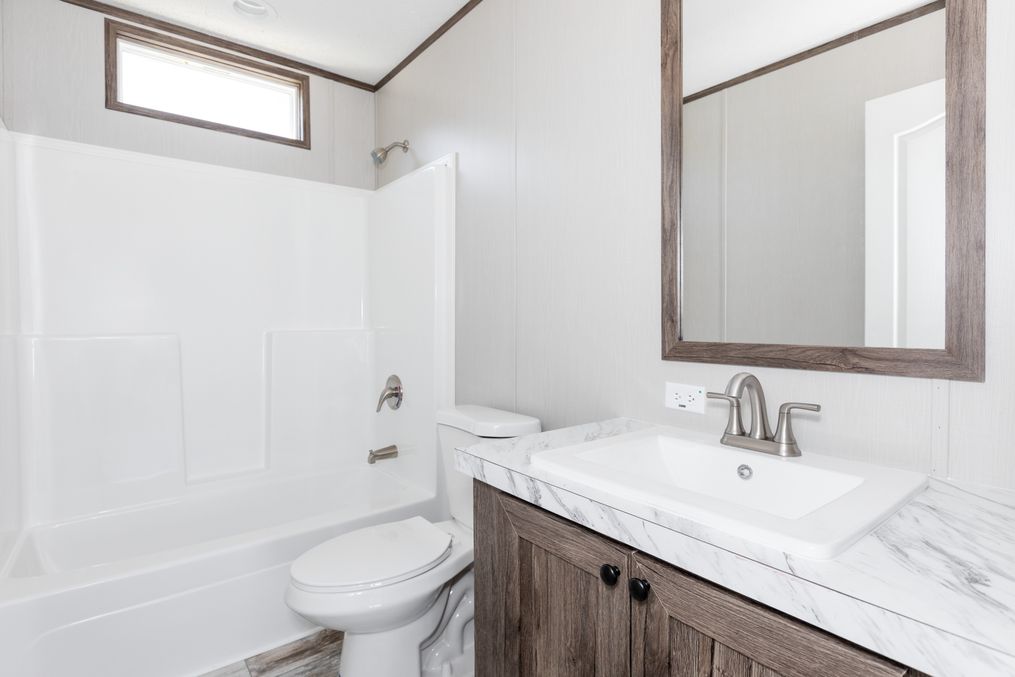 The LEWIS Guest Bathroom. This Manufactured Mobile Home features 3 bedrooms and 2 baths.
