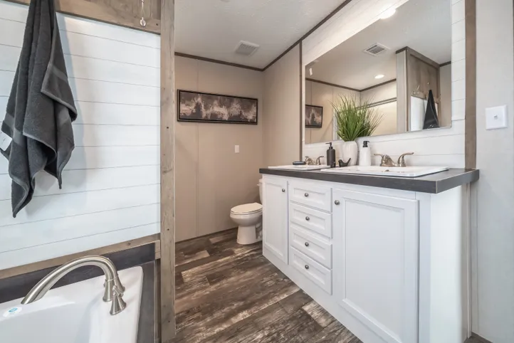 The RIVERHAVEN Primary Bathroom. This Manufactured Mobile Home features 3 bedrooms and 2 baths.