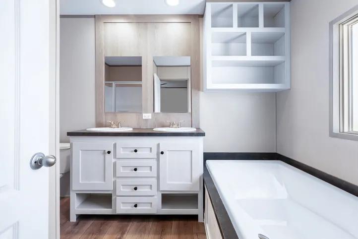 The ANNIVERSARY 16602A Primary Bathroom. This Manufactured Mobile Home features 2 bedrooms and 2 baths.