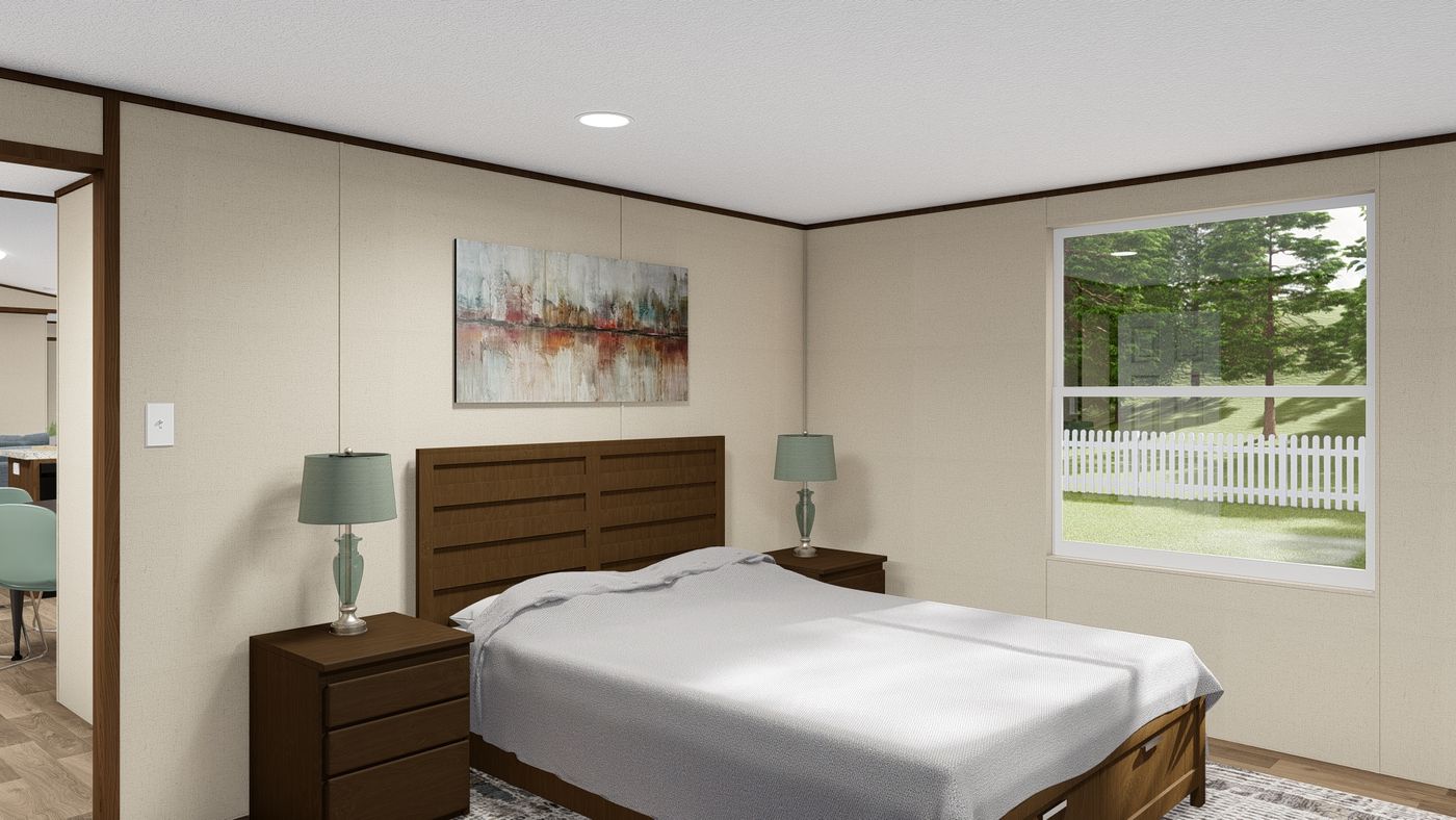 The DELIGHT Primary Bedroom. This Manufactured Mobile Home features 2 bedrooms and 2 baths.