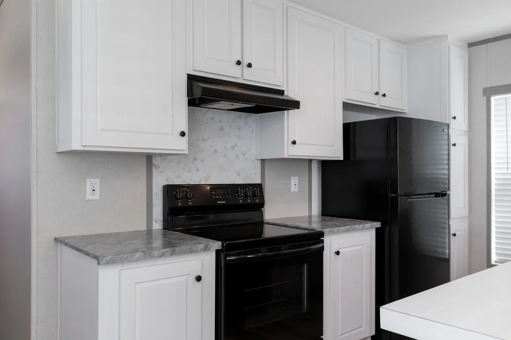 The BLAZER 66 F Kitchen. This Manufactured Mobile Home features 3 bedrooms and 2 baths.