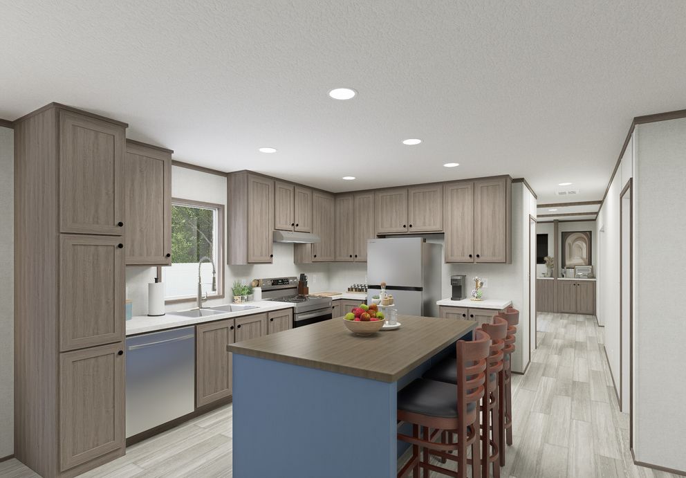 The THE MOUNTAINEER 64 Kitchen. This Manufactured Mobile Home features 3 bedrooms and 2 baths.