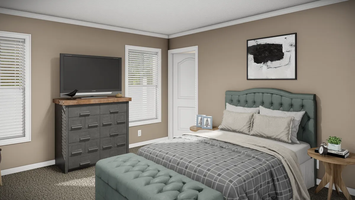 The THE MAVERICK Primary Bedroom. This Manufactured Mobile Home features 3 bedrooms and 2 baths.