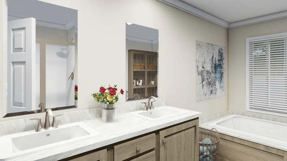 The CAROLINIAN M5010 Primary Bathroom. This Manufactured Mobile Home features 3 bedrooms and 2 baths.
