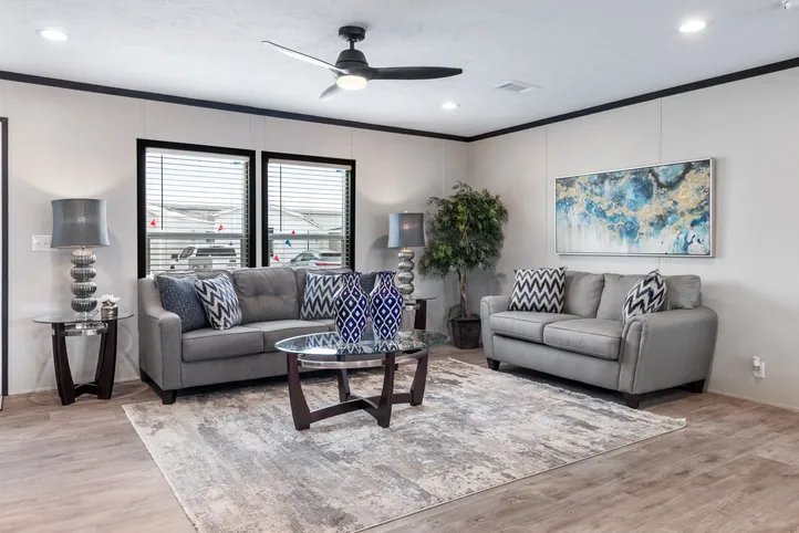 The HERCULES Living Room. This Manufactured Mobile Home features 4 bedrooms and 2 baths.