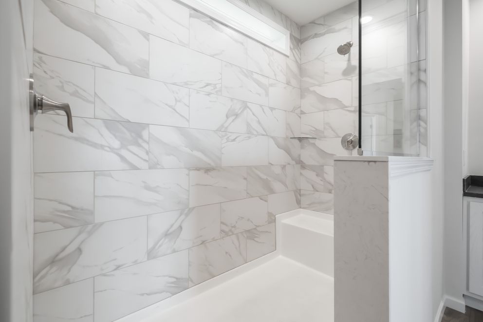 The 1533 THE BROOK HUD Primary Bathroom. This Manufactured Mobile Home features 3 bedrooms and 2 baths.