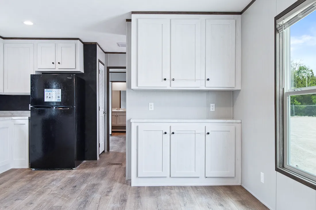 The HOMESTEAD 16562A Dining Area. This Manufactured Mobile Home features 2 bedrooms and 2 baths.