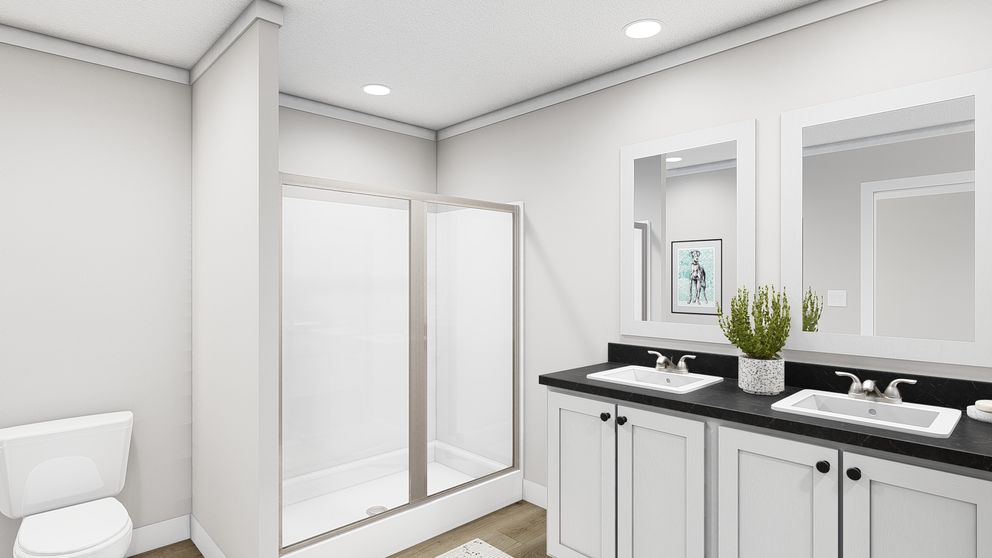 The SWEET CAROLINE Primary Bathroom. This Manufactured Mobile Home features 3 bedrooms and 2 baths.