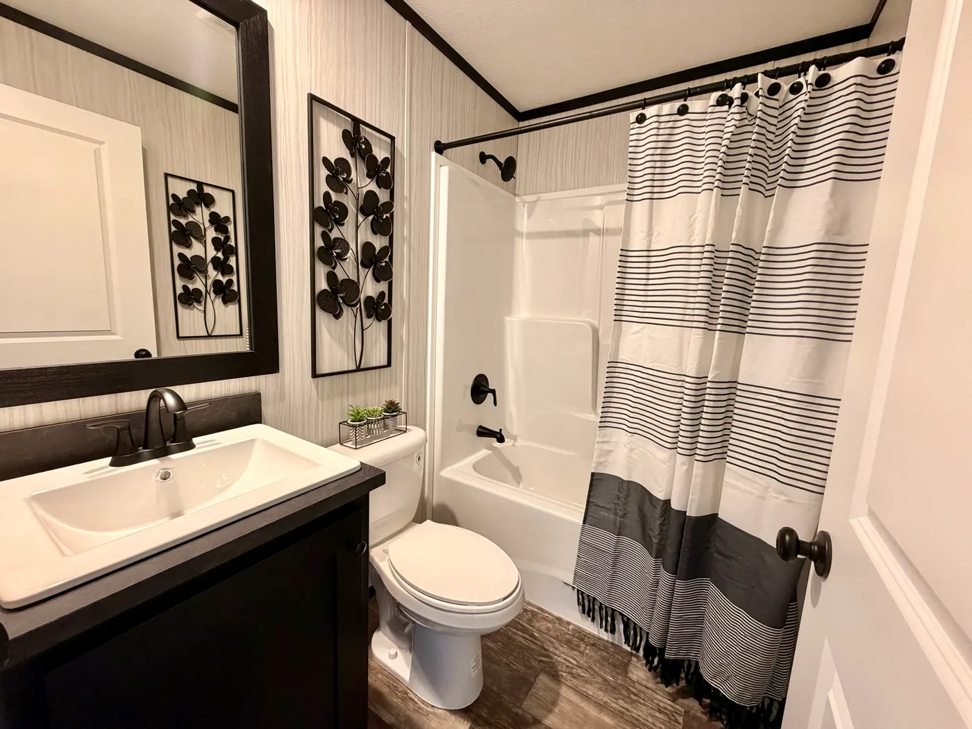 The PEARL Guest Bathroom. This Manufactured Mobile Home features 3 bedrooms and 2 baths.