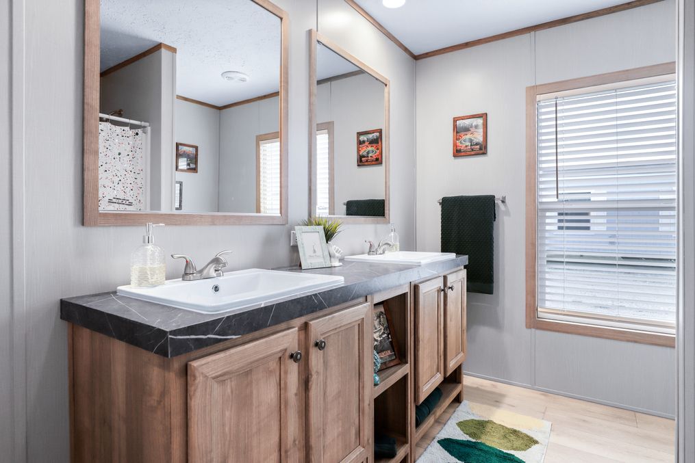 The BLUEBONNET BREEZE Guest Bathroom. This Manufactured Mobile Home features 3 bedrooms and 2 baths.