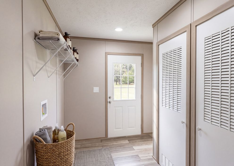 The THE MOUNTAINEER 76 Utility Room. This Manufactured Mobile Home features 4 bedrooms and 2 baths.