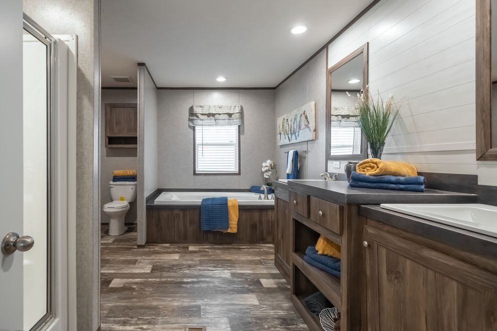 The LOCKLEAR Exterior. This Manufactured Mobile Home features 4 bedrooms and 2 baths.