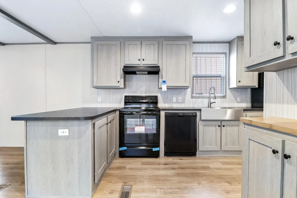 The ANNIVERSARY 16763A Exterior. This Manufactured Mobile Home features 3 bedrooms and 2 baths.