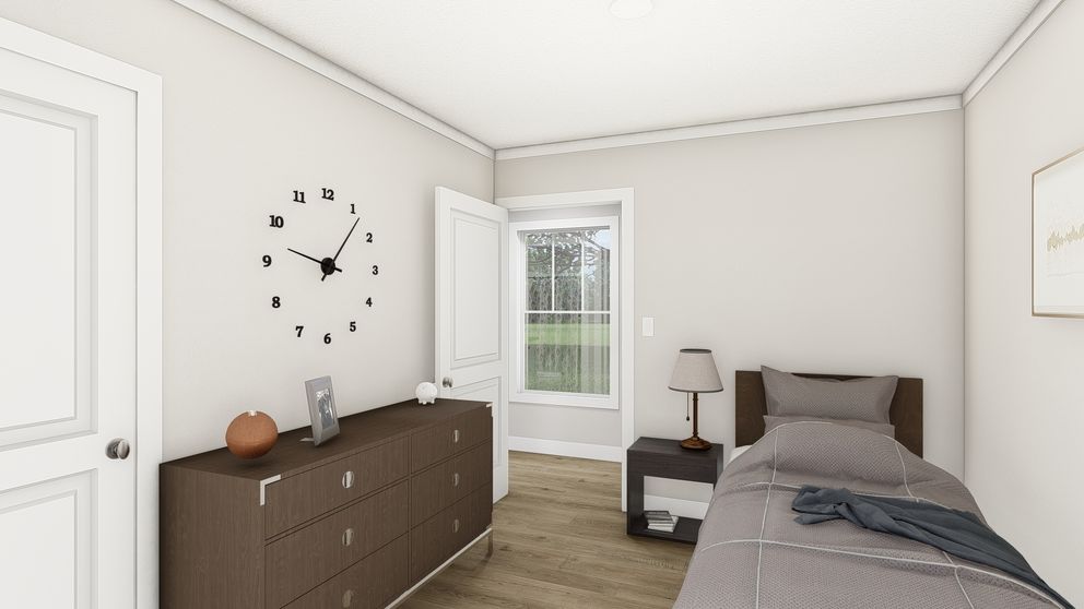 The SWEET CAROLINE Guest Bedroom. This Manufactured Mobile Home features 3 bedrooms and 2 baths.