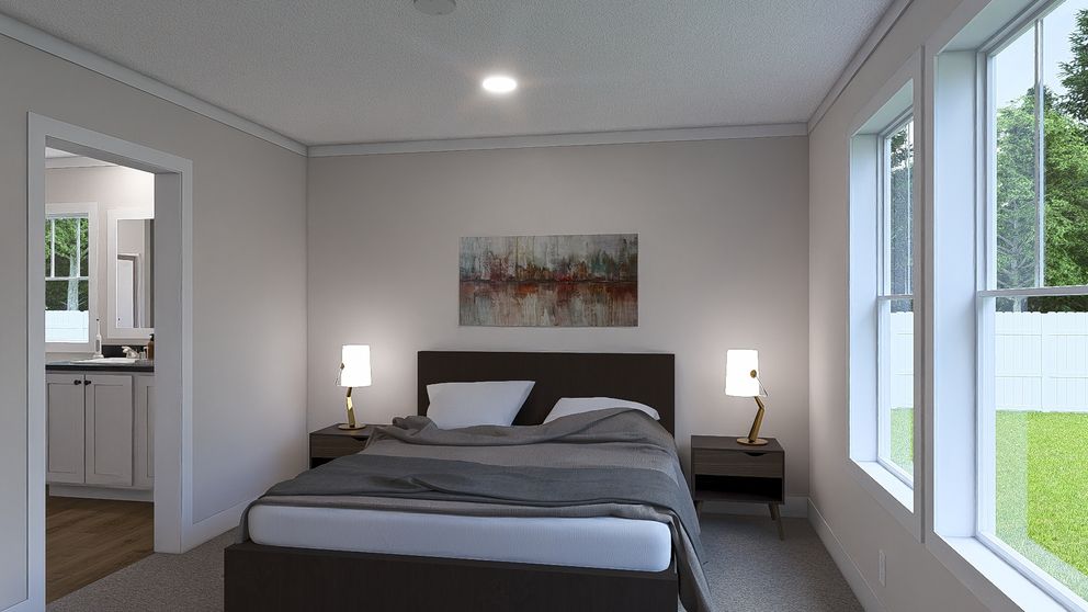 The WHOLE LOTTA LOVE Primary Bedroom. This Manufactured Mobile Home features 3 bedrooms and 2 baths.