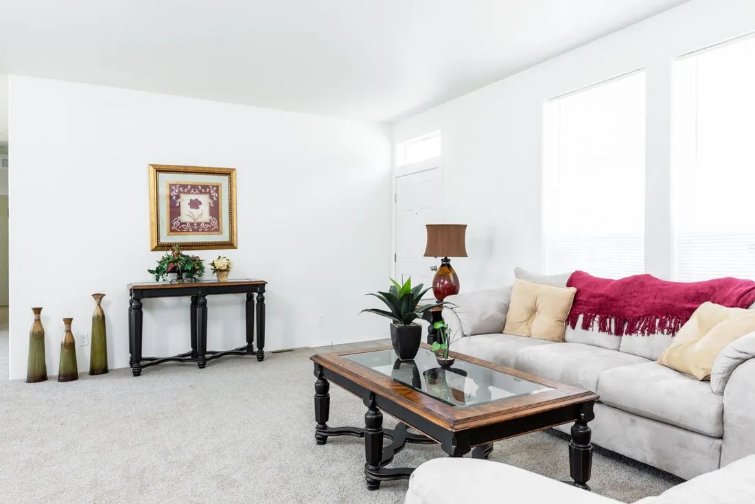 The 2025 COLUMBIA RIVER (NEW) Living Room. This Manufactured Mobile Home features 4 bedrooms and 2 baths.