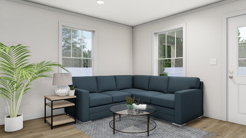The ROCKET MAN Living Room. This Manufactured Mobile Home features 3 bedrooms and 2 baths.