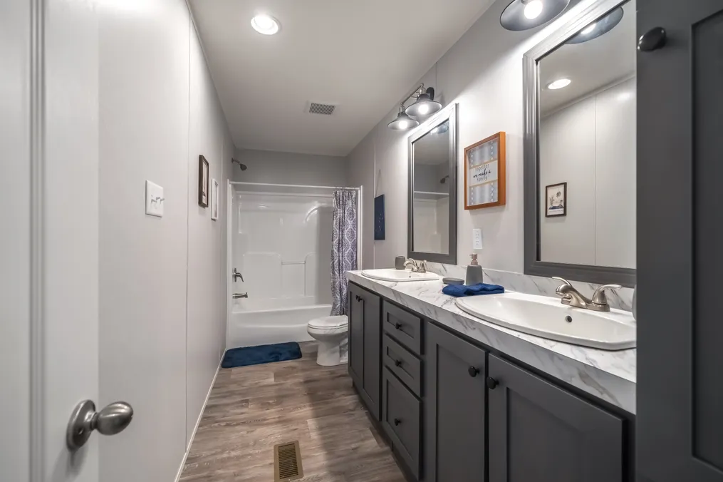The THE FUSION 32B Guest Bathroom. This Manufactured Mobile Home features 4 bedrooms and 2 baths.