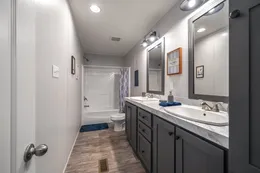 The THE FUSION 32B Guest Bathroom. This Manufactured Mobile Home features 4 bedrooms and 2 baths.