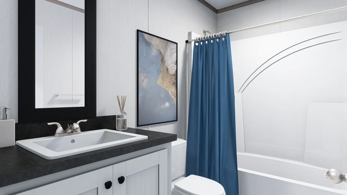 The 6614-4701 THE PULSE Guest Bathroom. This Manufactured Mobile Home features 3 bedrooms and 2 baths.