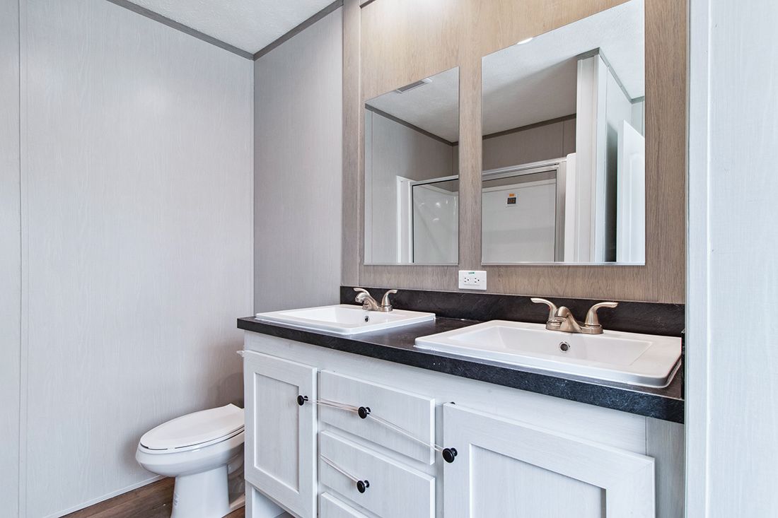 The ANNIVERSARY 16682A Guest Bathroom. This Manufactured Mobile Home features 2 bedrooms and 2 baths.