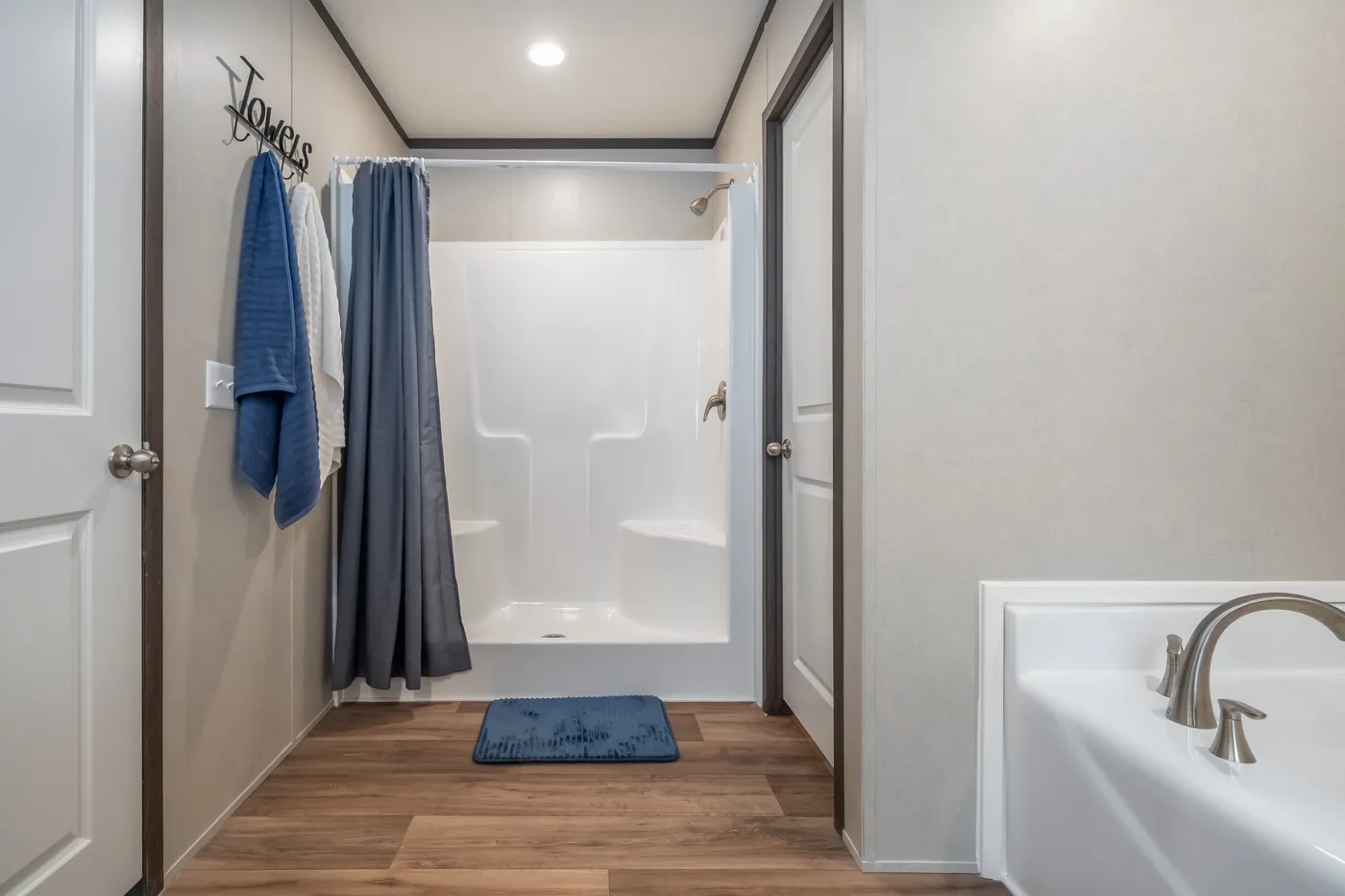 The DYNAMIC Primary Bathroom. This Manufactured Mobile Home features 3 bedrooms and 2 baths.