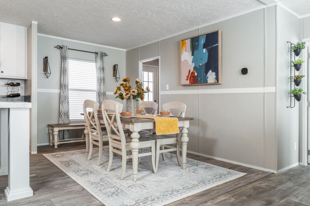The TRADITION 48 Dining Area. This Manufactured Mobile Home features 3 bedrooms and 2 baths.